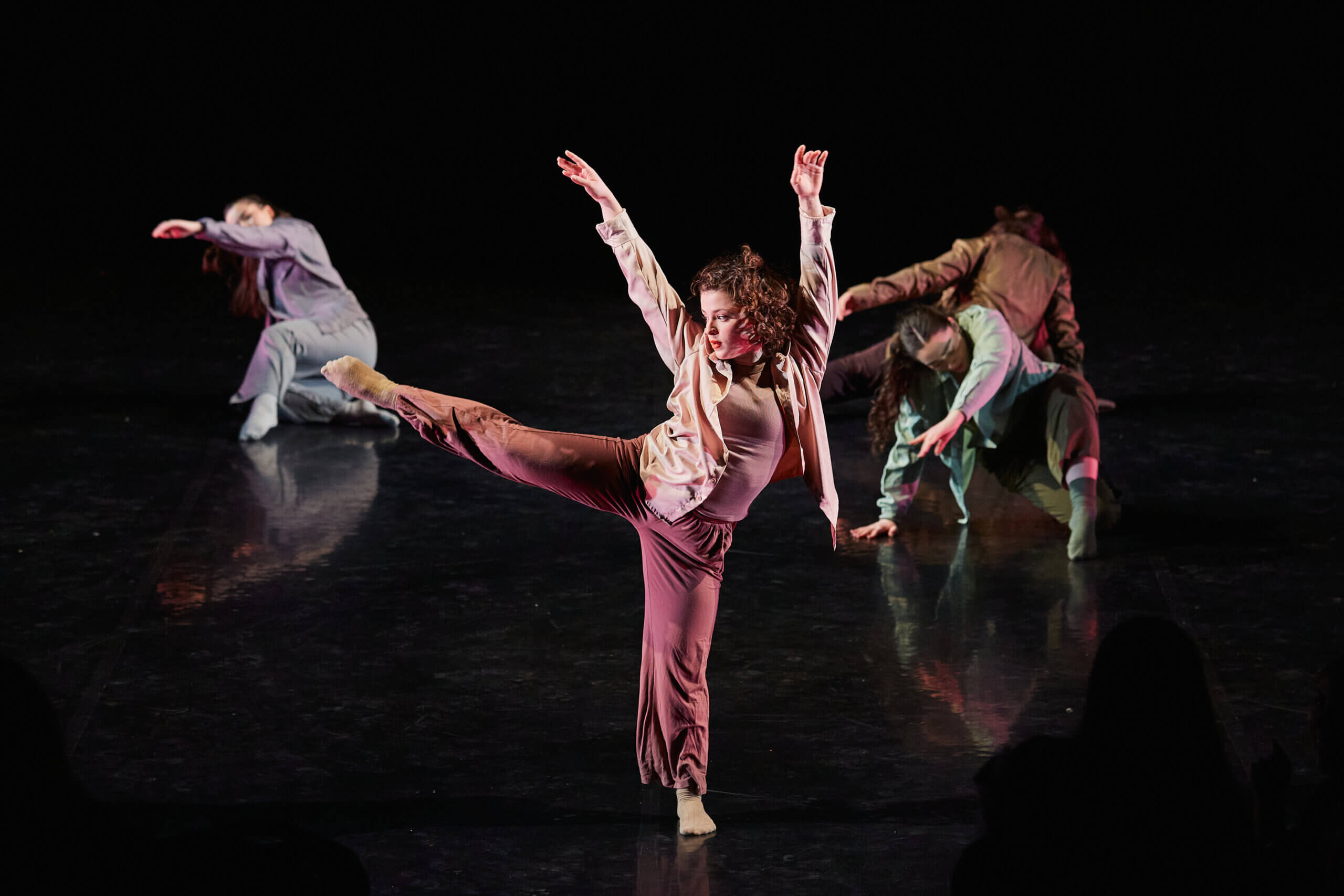 Dancers performing on stage.