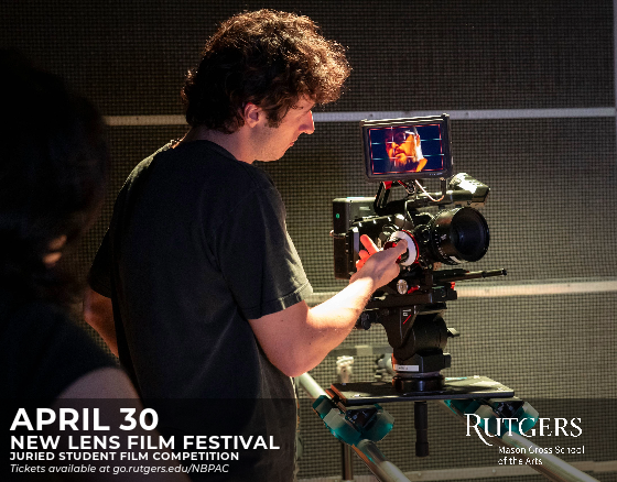 A film student operates a camera. 