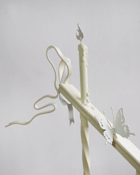 Artwork of pale colored objects, including a candle and a butterfly, by artist Abigail Lucien.