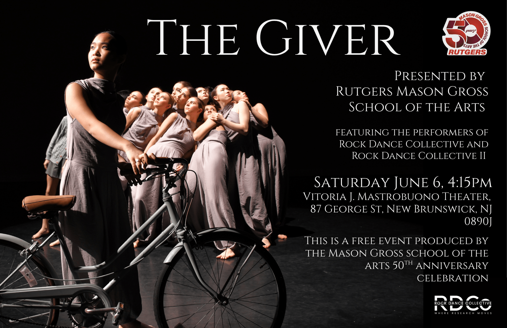 Rock Dance Collective dancers gathered on stage with one standing next to a bicycle, holding onto the handlebars. 