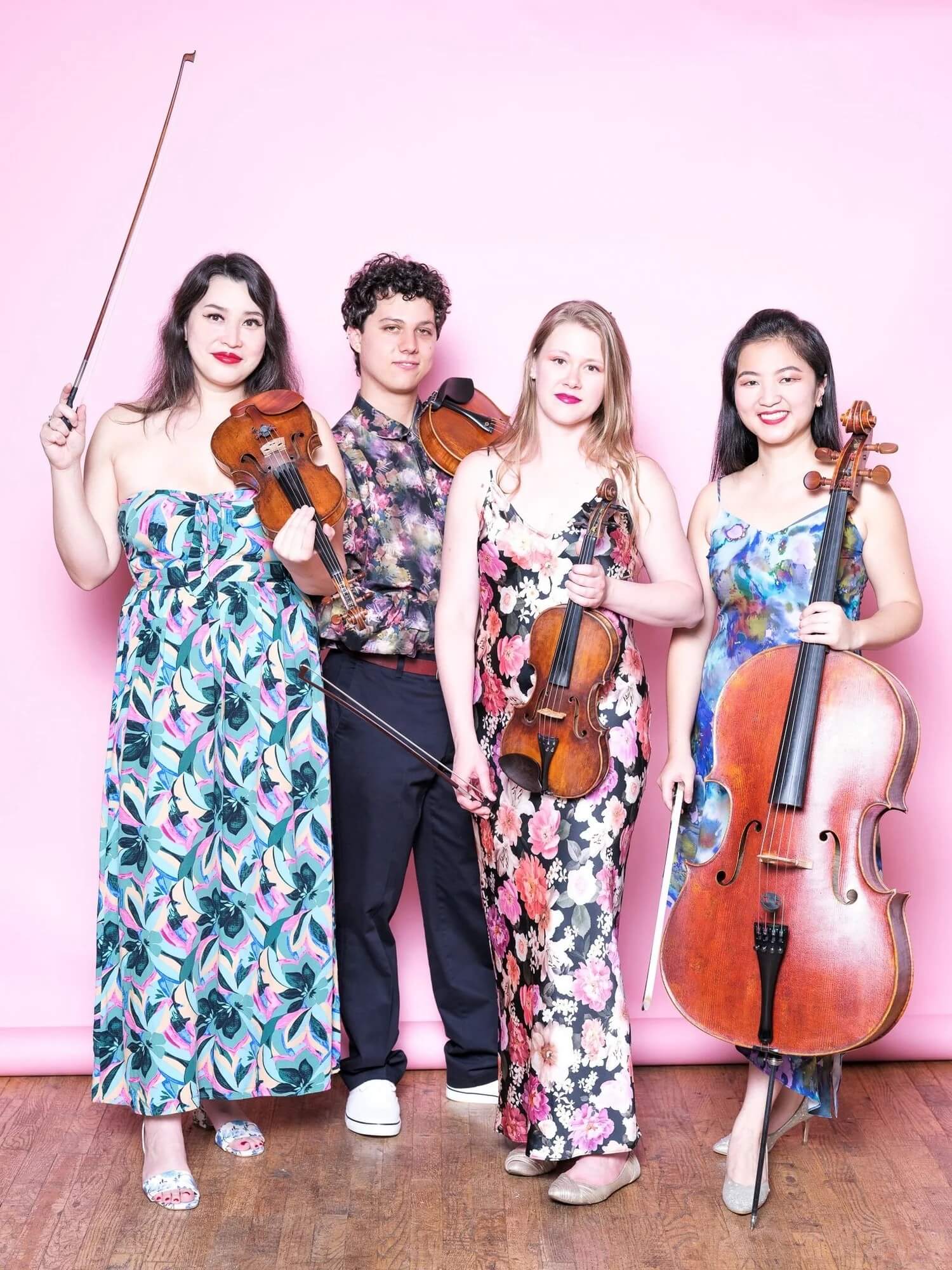 Four students pose with their instruments.